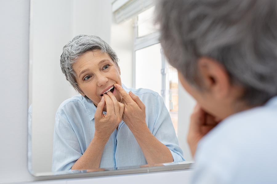 bigstock-Mature-beautiful-woman-cleanin-279235894.jpg thumbnail image of blog post what happens when i forget to floss?