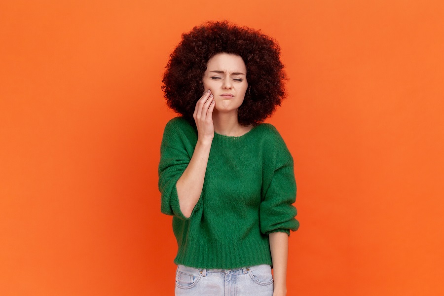 bigstock-Sick-Woman-With-Afro-Hairstyle-452648291.jpg thumbnail image of blog post why do i have a toothache?